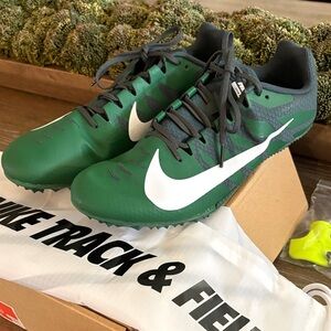 NWOT Nike Green Track & Field shoe with White Swoosh. Size US 12 in box.